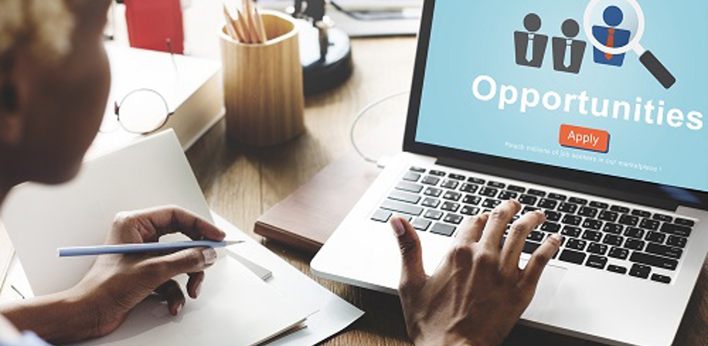 nojs Person looking at laptop with the word opportunity on screen