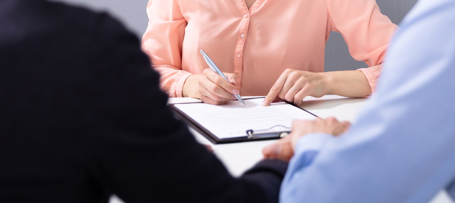 nojs Couple meeting with a lady doing paperwork.