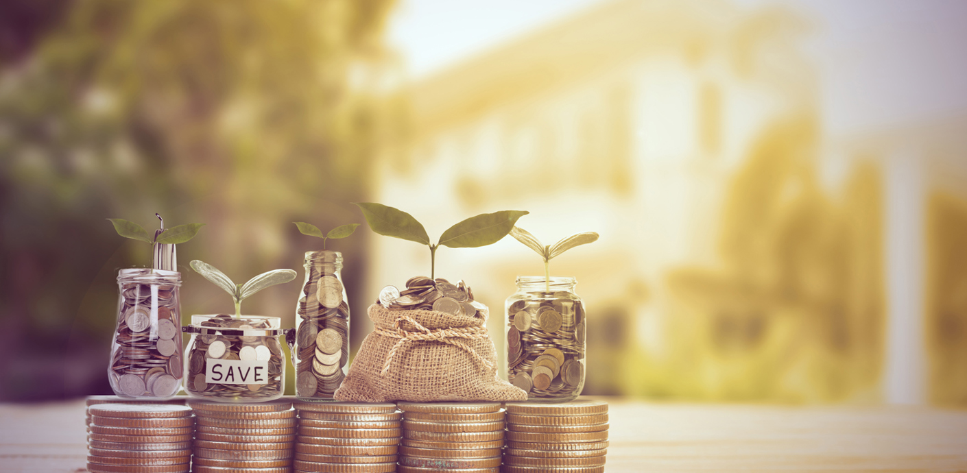 nojs Five equal stacks of coins topped with glass jars and a hessian bag with more coins inside and plant sprouts representing growth.