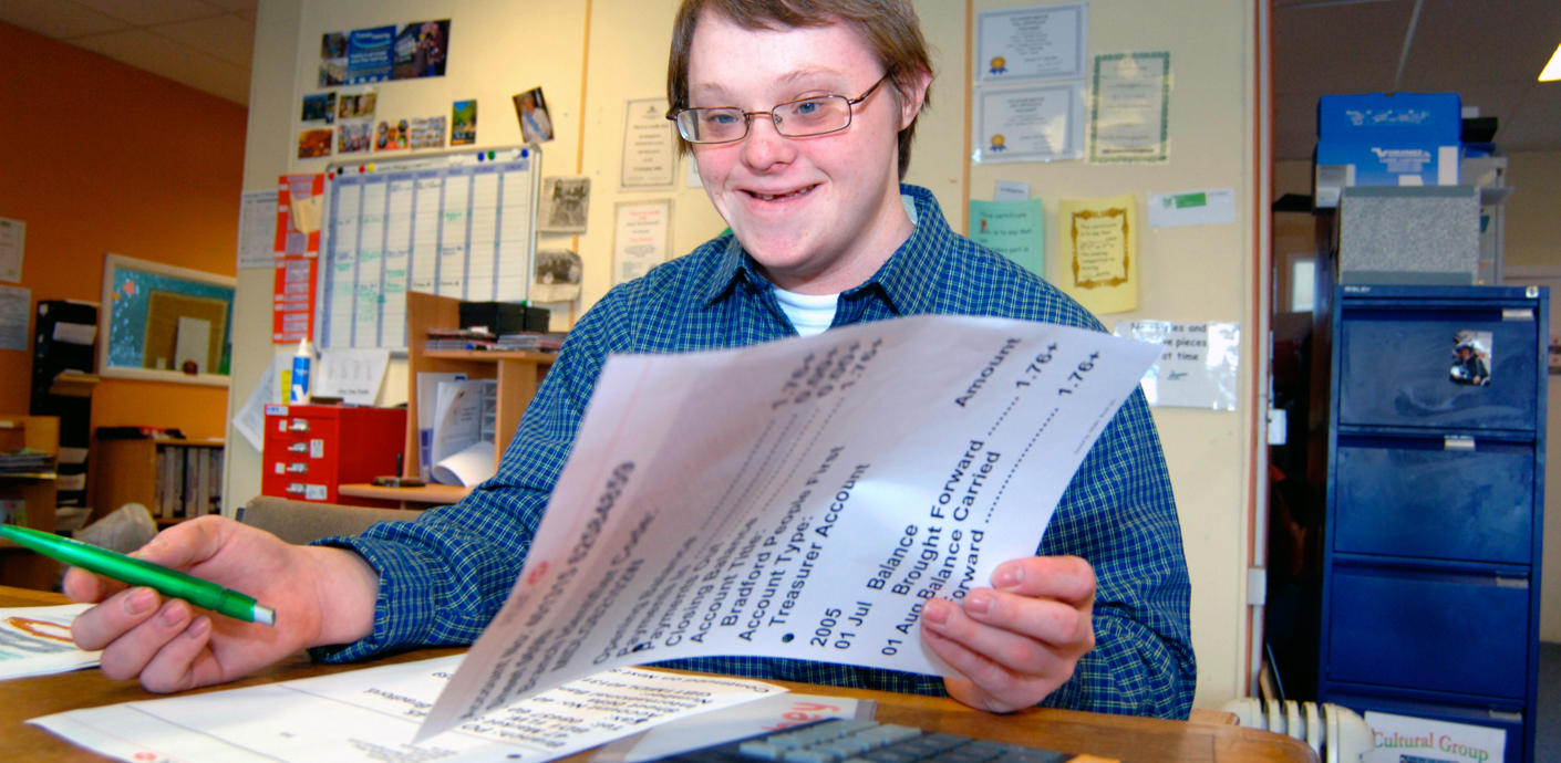 nojs Disabled young person with paperwork.
