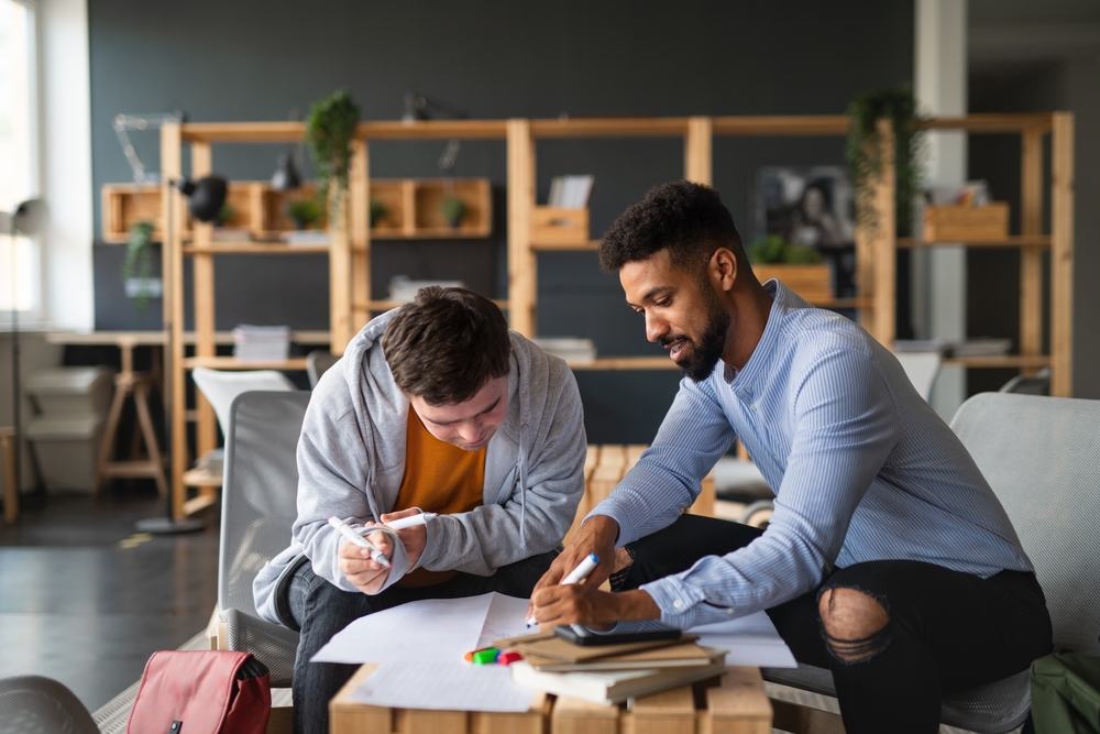 Two people working