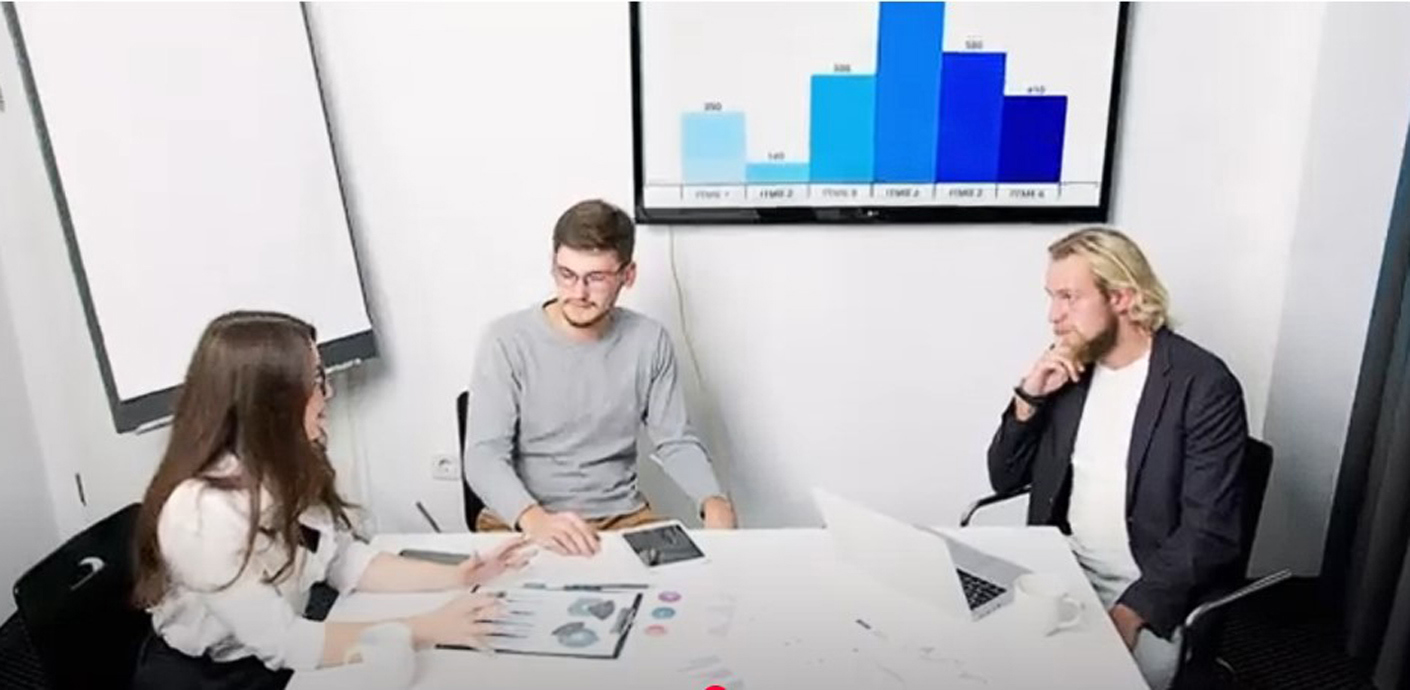 Three people sitting at a table