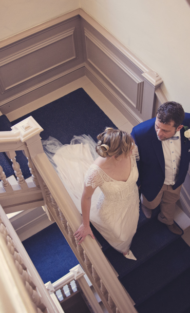 Bride and groom on staircase