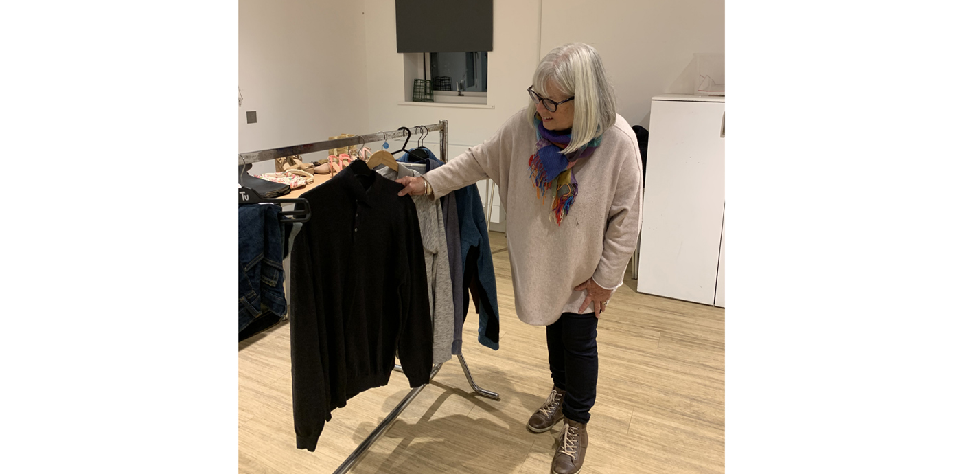 nojs Woman looking at clothes on a clothes rail